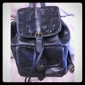 Black leather backpack with lace detailing